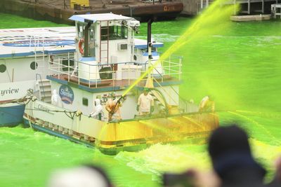 9 photos of the Chicago River dyed green to celebrate St. Patrick’s Day