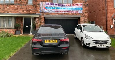 Homeowner puts up warning banner in two-year battle with developers over faults in his £500,000 house