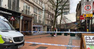 Police cordon off street in city centre after man's body found