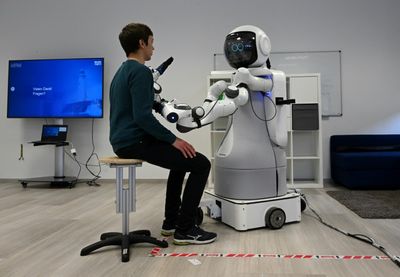 Lacking health workers, Germany taps robots for elder care