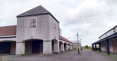 Once-thriving UK shopping centre now guarded compound with dogs and spiked fence