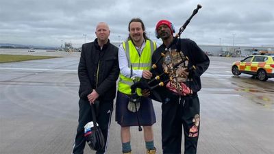 Drop it like a Scot: Snoop Dogg greeted by gangsta bagpiper as he touches down at Glasgow Airport