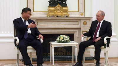 Xi meets "dear friend" Putin in Moscow