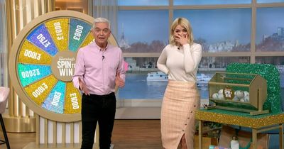 Holly Willoughby puts head in hands as Spin to Win caller's unusual location sparks chaos on This Morning