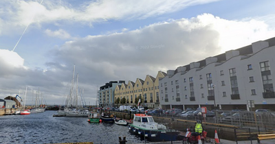 Army vehicle with Russian flag covered by Galway port staff after being abandoned on docks