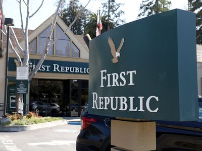 First Republic Bank shares sink to another record low, but stock markets are calmer