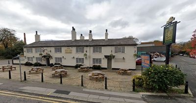 Two men spotted by hospital staff on pub roof trying to break in