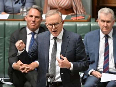 PM stares down raucous caucus over nuclear subs deal