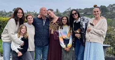 Bruce Willis hugs his ex wife and all his children in rare snap after dementia diagnosis
