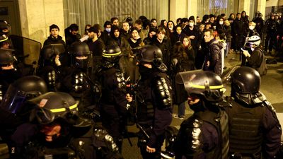 Hundreds arrested as French protests continue after government survives no-confidence vote