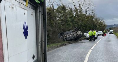 Vehicle flips over on south Dublin road as military police assist gardai and firefighters