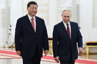 Putin hosts Xi in the Kremlin with imperial palace pageantry