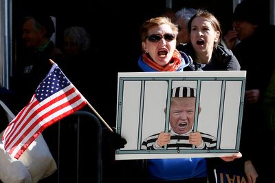 Trump asking friends if he should smile for cameras if arrested, reports say