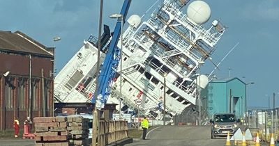 Large boat blown onto side at Leith docks amid high winds as emergency crews race to scene