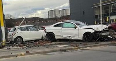 White car 'ploughs into' Glasgow motors parked at Arnold Clark garage causing smash