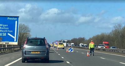 Coach with children on board crashes through motorway barrier after crash with car
