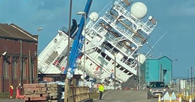 Dozens injured after huge ship owned by billionaire tips over at Edinburgh's Imperial Dock