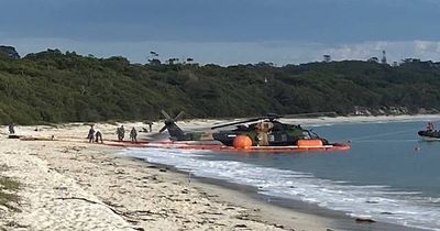 Explosion, fire seconds before Defence helicopter ditches into Jervis Bay