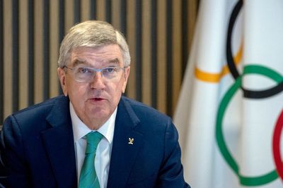 IOC's Bach defends Russia stance amid pro-Ukraine protest