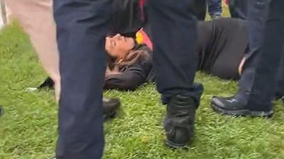 Lidia Thorpe pulled to ground by police officer after attempting to interrupt anti-trans-rights rally