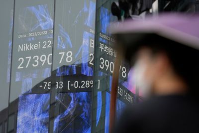 Asian shares mixed after Fed hints rate hikes may end soon