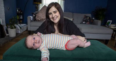 Baby weighing 13 POUNDS dubbed 'chunky monkey' and wears clothes for six-month-old tots