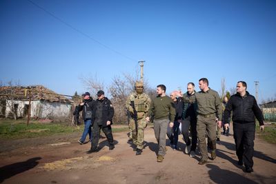 Ukraine's Zelenskiy visits Kherson region, vows to repair war damage