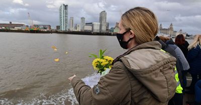 Rose petals dropped into Mersey as tributes paid to covid victims