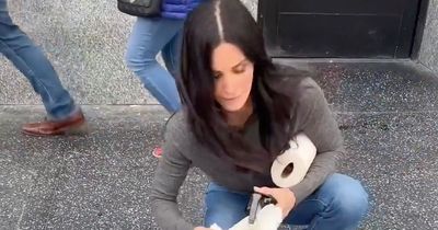 Courteney Cox hilariously channels inner Monica Geller as she cleans Walk of Fame star