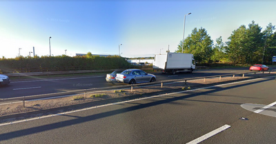 Busy road near Glasgow shut down as emergency services race to two-car crash