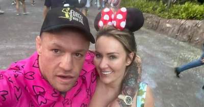 Dee Devlin shares loved up snaps with Conor McGregor as she poses in Minnie Mouse ears in Disneyland