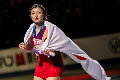 Japan's Sakamoto survives wobble to retain world skating title
