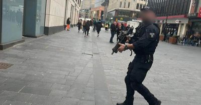 Armed police spotted running through the streets of Liverpool city centre