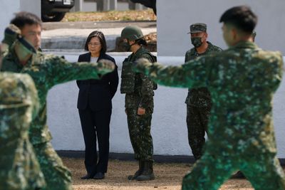 Taiwan president reviews troops ahead of sensitive U.S. visit