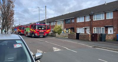Road closed after fire crews race to house fire