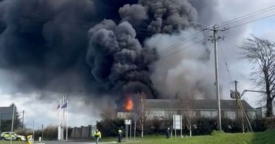 Huge blaze rips through New Ross premises as fire services rush to scene