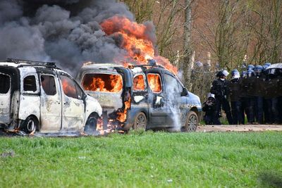 Police vehicles set on fire as French riots continue after King’s visit cancelled