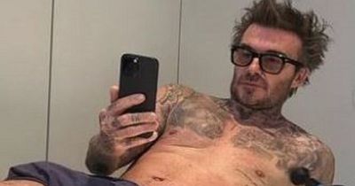 Victoria Beckham pokes fun at husband David as she shares snaps of him 'not wearing very much' during his and hers workout