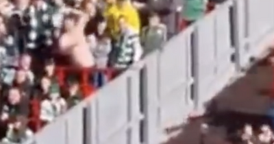 Watch Celtic fan fall short as he throws shirt in response to Liverpool supports' taunts