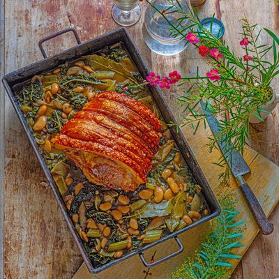 Slow-cooked pork shoulder, greens and butter beans recipe by Georgina Hayden