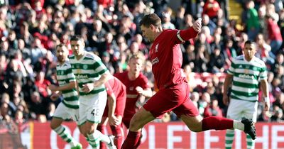 Steven Gerrard celebrates in front of Celtic fans as missiles were thrown following Liverpool goal