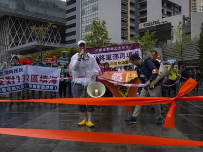 Hong Kongers hold their first authorized protest in years, under strict rules