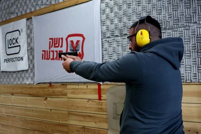 Fearing Palestinian attacks, Israelis seek security in guns