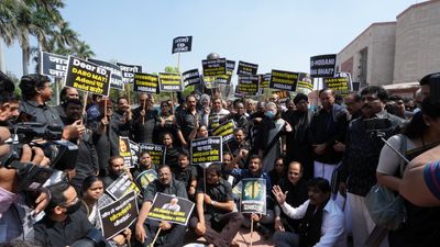 India's Congress lawmakers wear black to protest Rahul Gandhi's dismissal