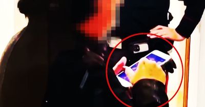 Fraudster who pretended to be blind unmasked as she's caught scrolling through her phone