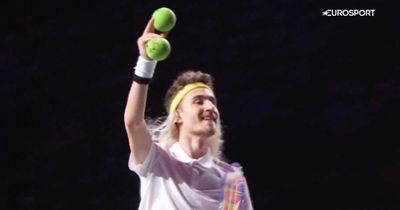 Skater impersonates tennis player with terrible wig and tiny racquet in bonkers routine