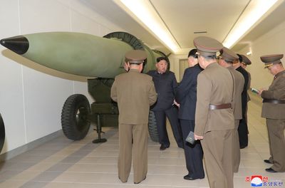 Kim urges N Korean experts to produce ‘powerful nuclear weapons’