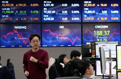Asian shares mostly rise on relief over US bank strength
