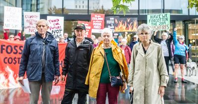 'Fight of our lives': Climate activists glue themselves to oil lobby building entry