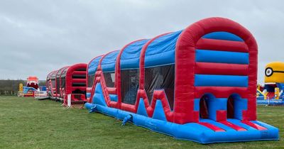 Outdoor inflatable park opening for Easter holidays with slides, obstacle courses and more